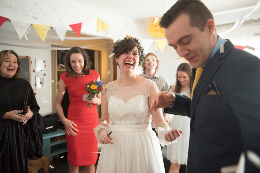 a year in review bride and groom celebrate as confetti falls all around them 
