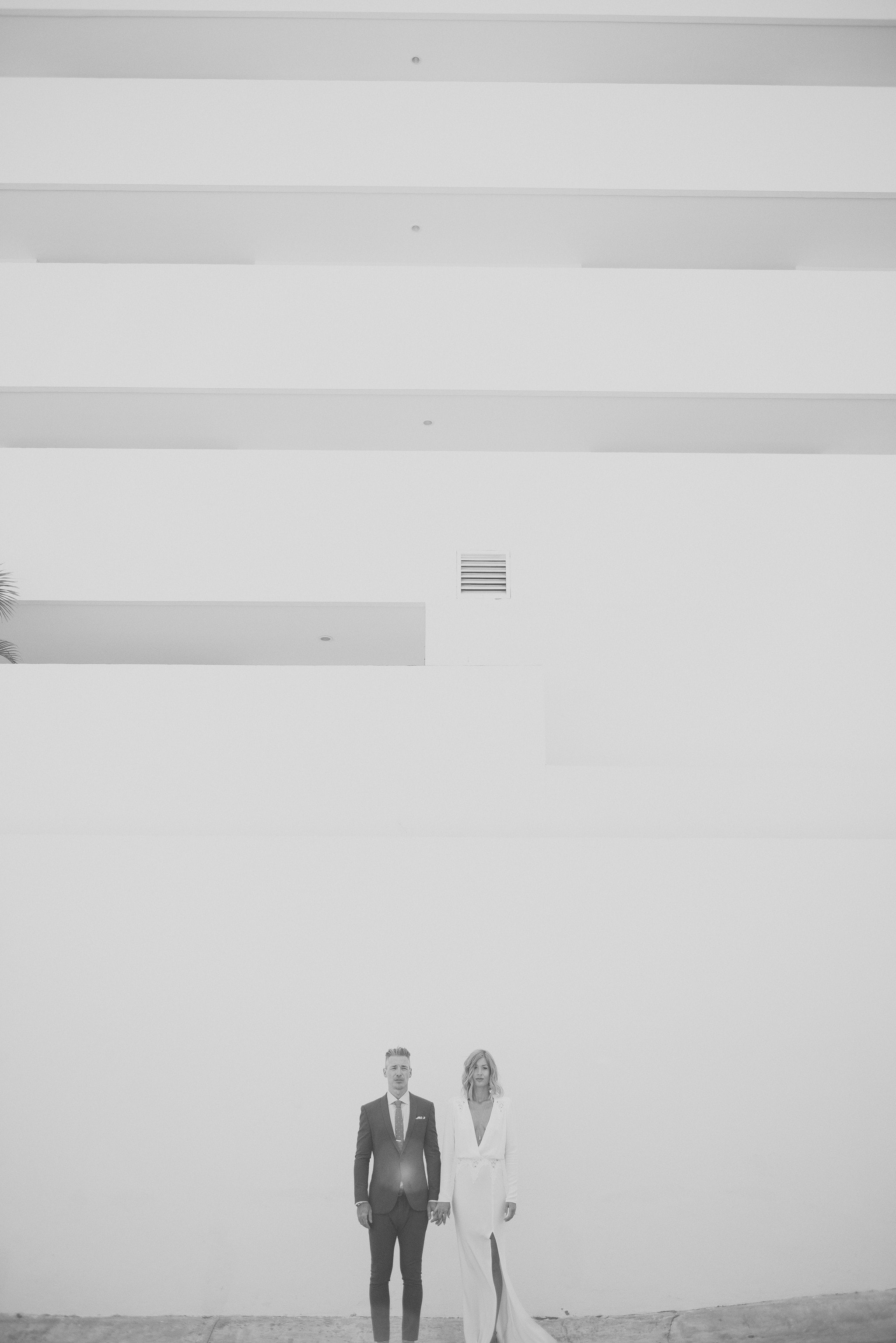 Bride and Groom in front of hotel 