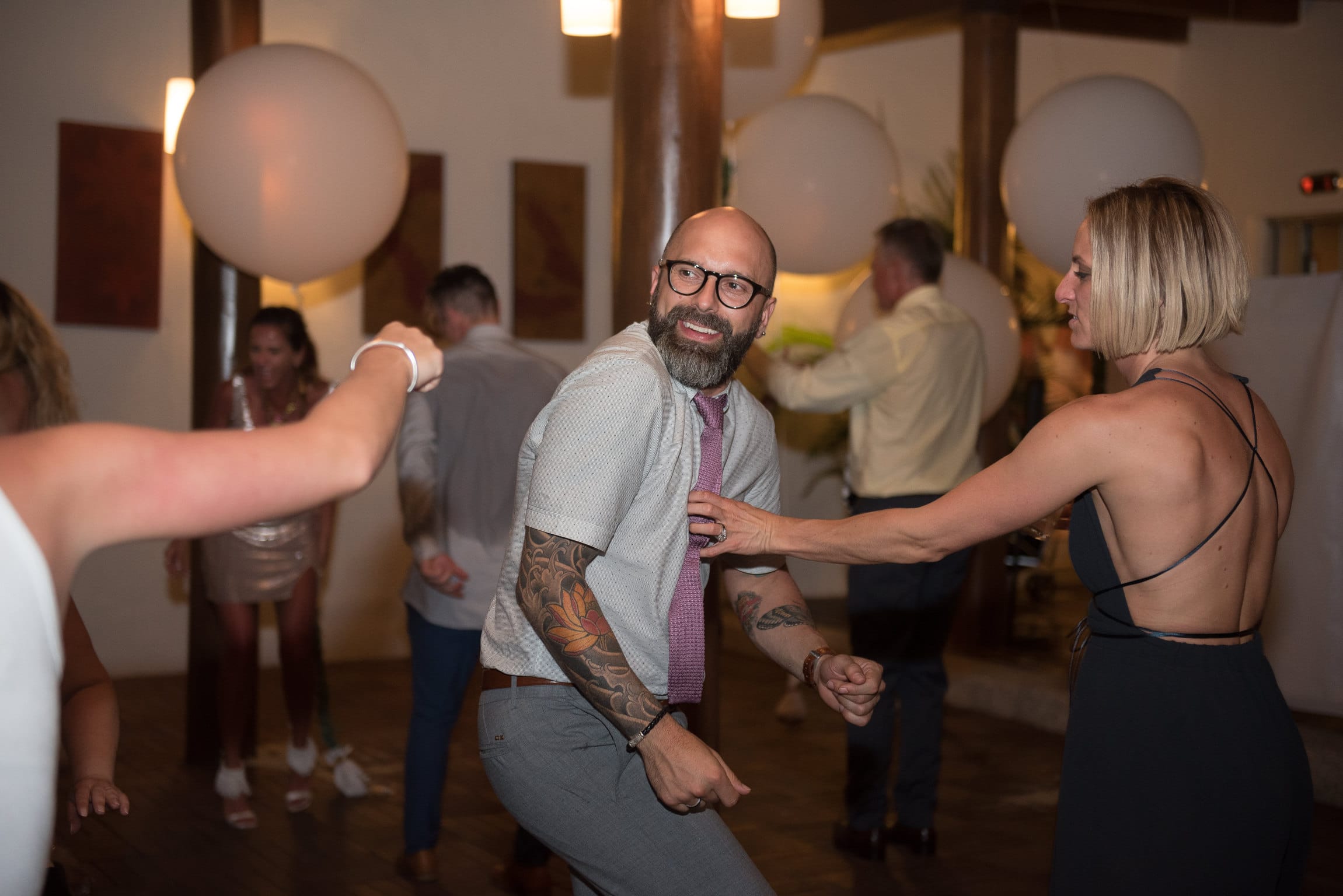 Stylish wedding guest dancing