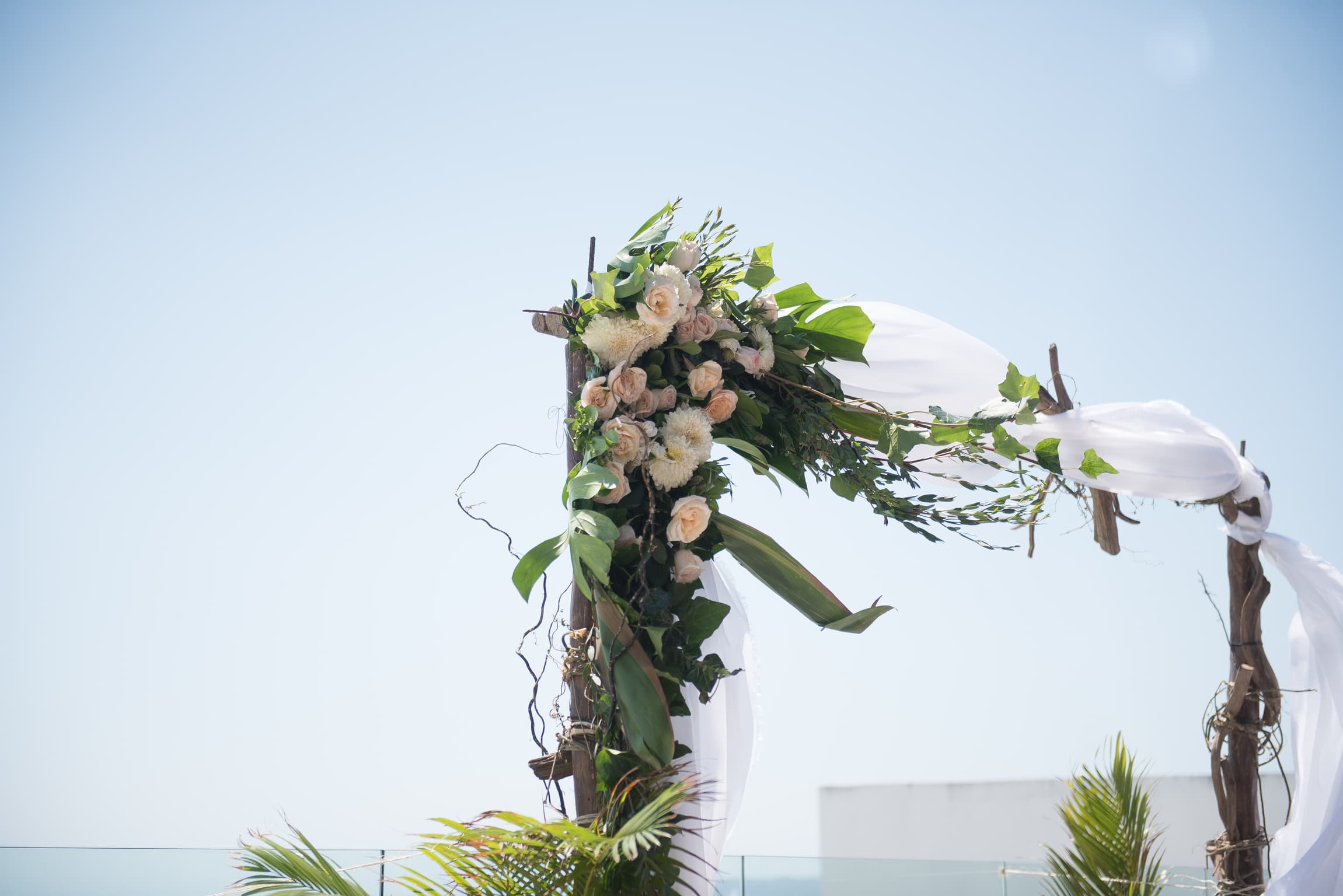 Archway with lush greens and flowers