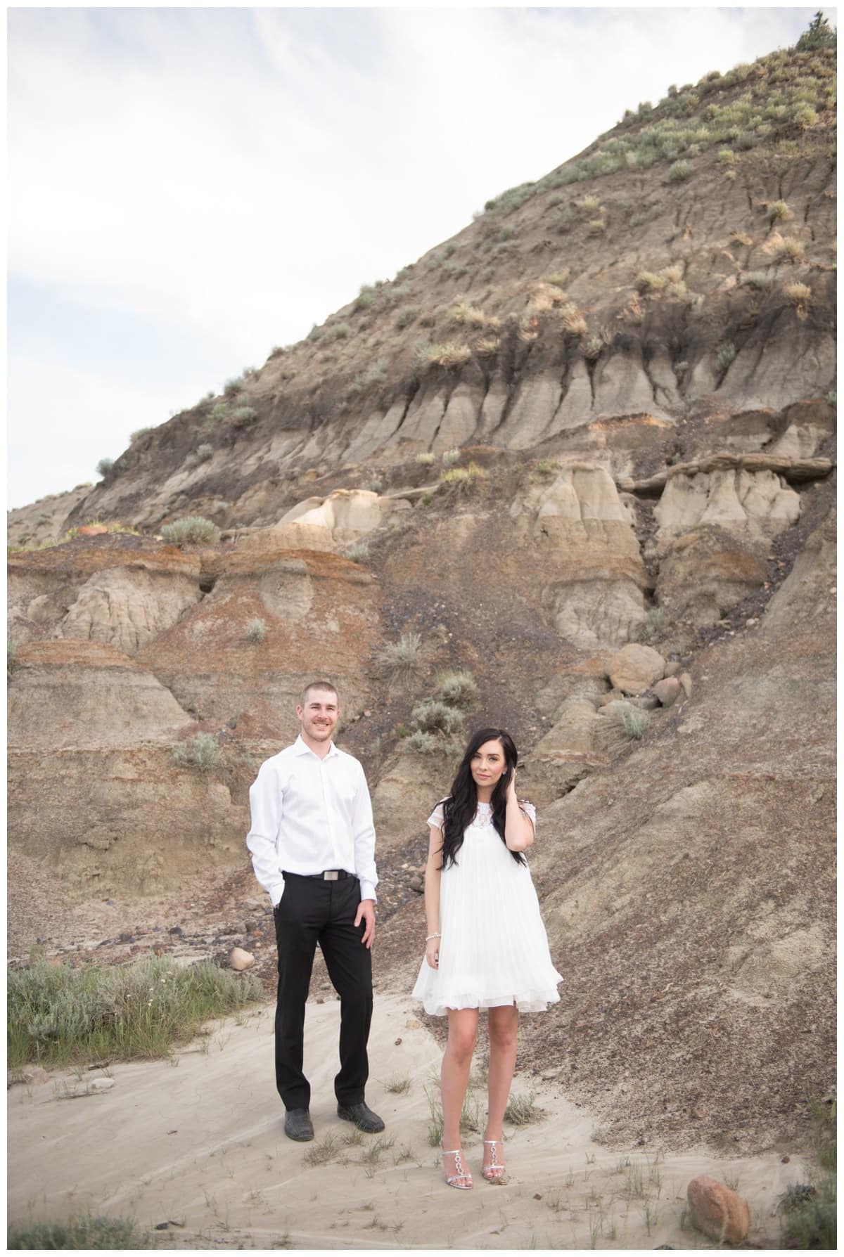 Beautiful couple wearing white standing in horseshoe canyon