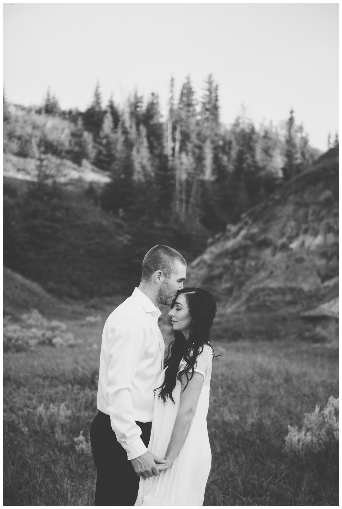 Beautiful couple walking through green valley Horseshoe Canyon Drumheller