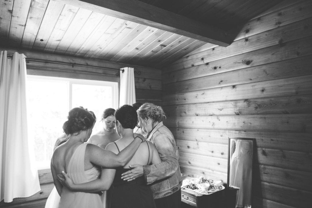 a year in review bridesmaids pray around bride 