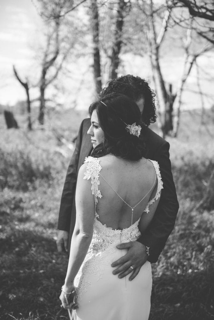 a year in review bride and groom snuggled together in fish creek park 