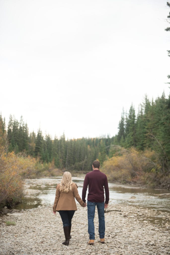 a year in review couple walks down riverbed in fish creek park calgary 