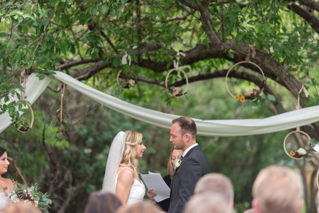 a year in review bride and groom during ceremony at rouge restaurant 