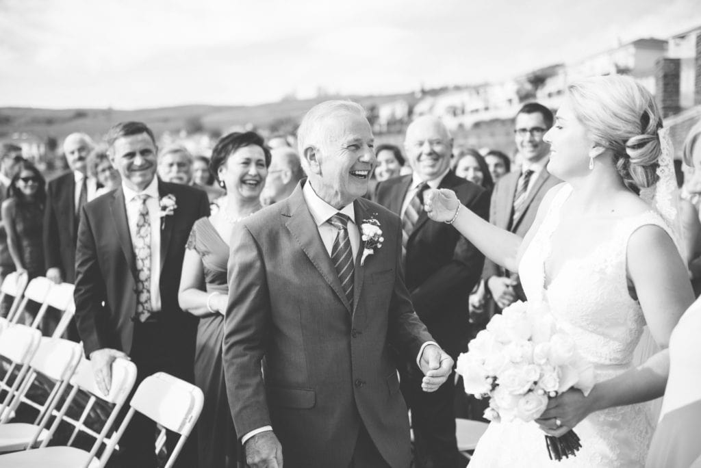 a year in review bride and dad hug before ceremony