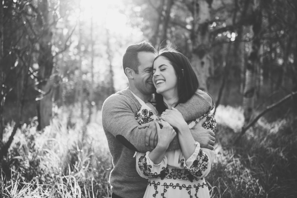 a year in review bride and groom laugh in embrace