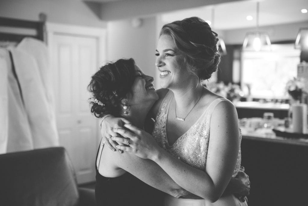 a year in review bride and mother share hug 