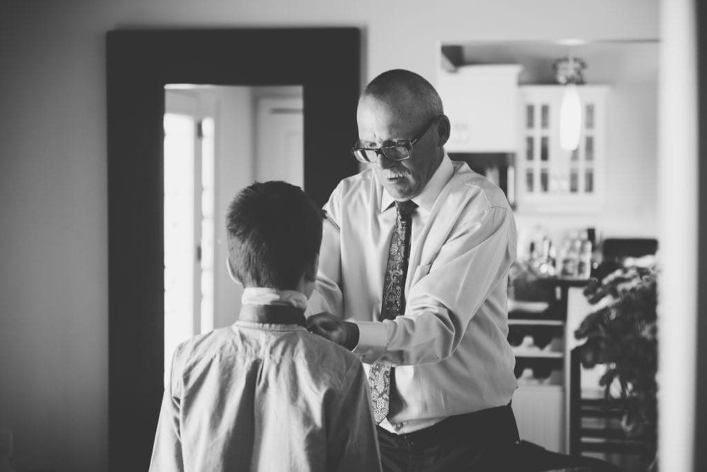 a year in review father of bride does up ring bearers tie 