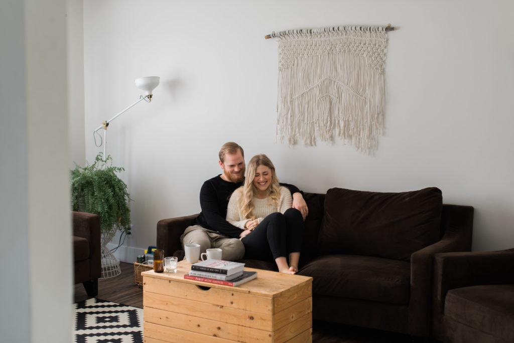 Intimate in home session couple embracing in living room